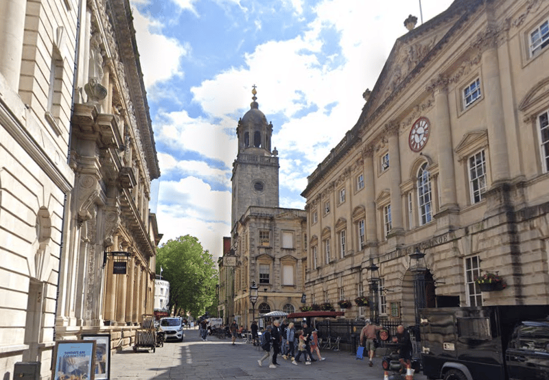 Corn Street is one of the four cross streets which met at the Bristol High Cross, the heart of the walled medieval Bristol town. It was the centre of trade from the 13th century and at the heart of Bristol's banking business from the 18th century. Nowadays, Corn Street is home to historic buildings such as the Corn Exchange and The Nails, four brass pillars used historically for merchants to strike deals.