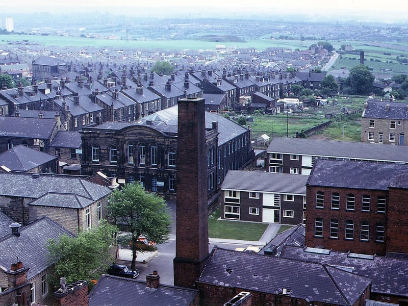Commercial Street taken from Morley Town Hall Tower. In the centre is the chimney belonging to the Co-op complex. To the left of this is Morley public library and to the right the red brick building of the Jute factory. Pictured in June 1973.