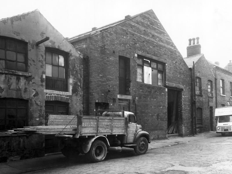Sheepscar Grove, on the left is a lorry belonging to W.T. Pearson Ltd, building and joinery contractor of 2 Sheepscar Grove. The building in the centre is the business of Phillip Freeman, fitted furniture maker. It was a former carriage works, the office was 6 Sheepscar Grove, a Freeman's delivery van is outside. The house on the end was number 4.