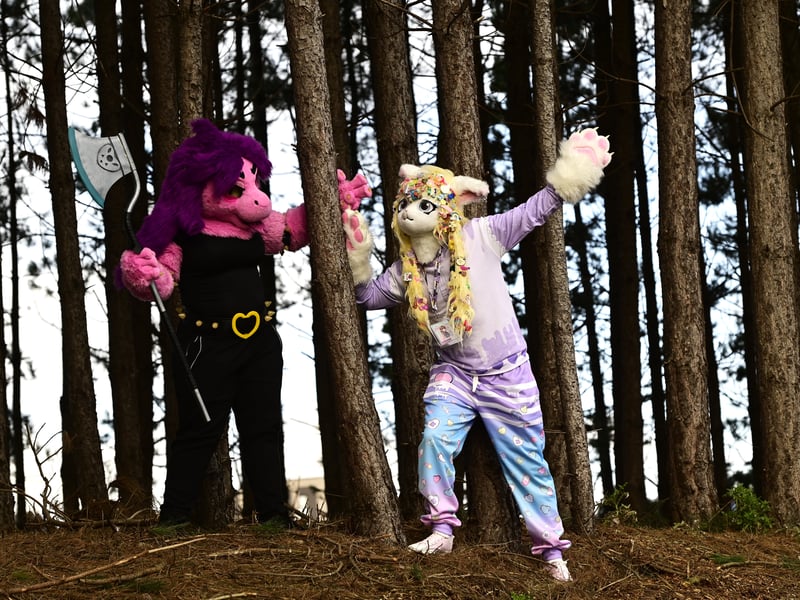 Furries pose in the trees near the convention centre.
