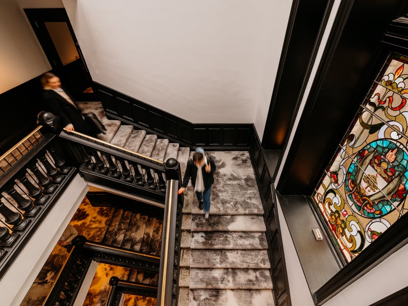 The hotel features an ornate staircase.
