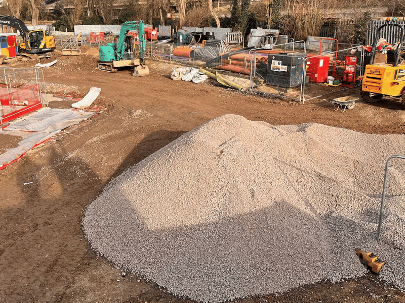 This is a rubble pile the team are using to prepare the ground around the pool ready to be surfaced.