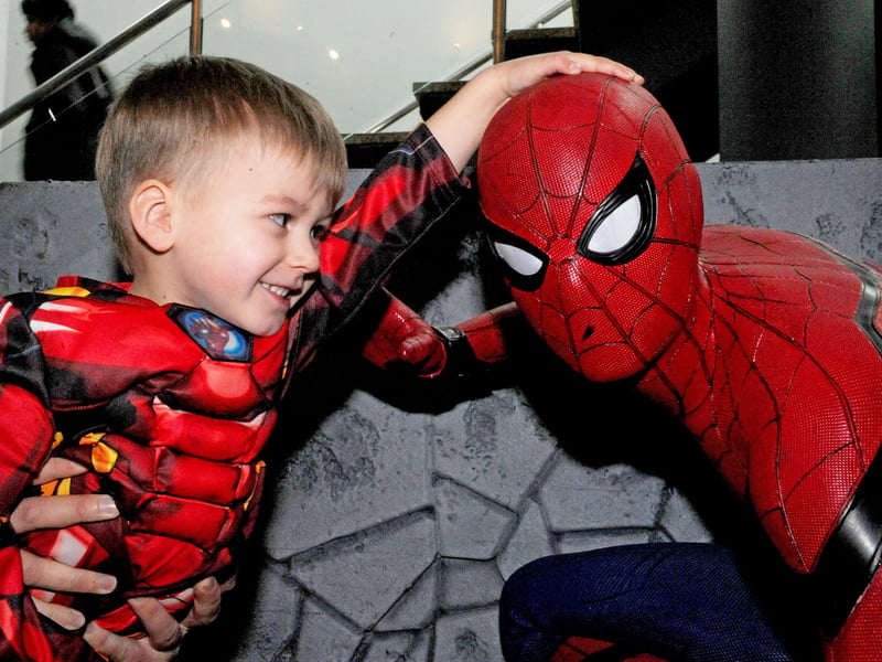 Oscar Butterworth, three, from Cleckheaton, gets up close to Spiderman as part of the festivities.