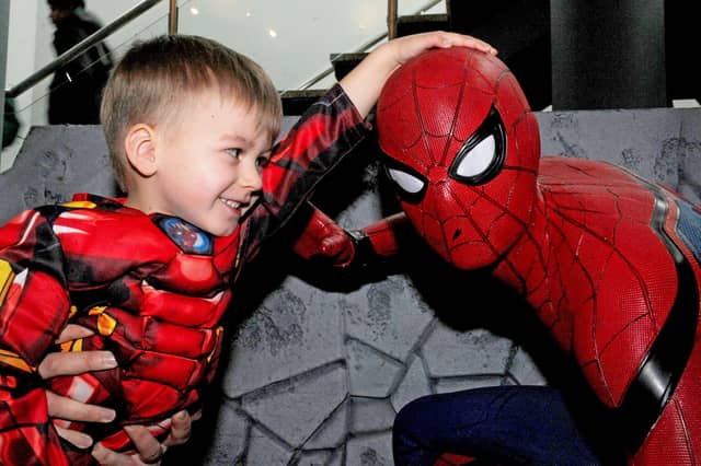 Oscar Butterworth, three, from Cleckheaton, gets up close to Spiderman as part of the festivities.