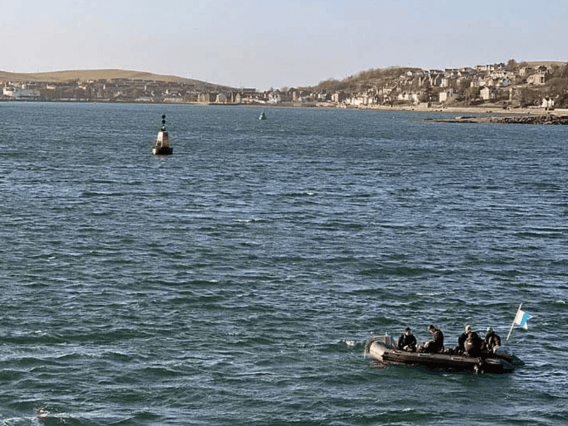 HMS Cattistock's divers complete identification of an object on the sea bed.