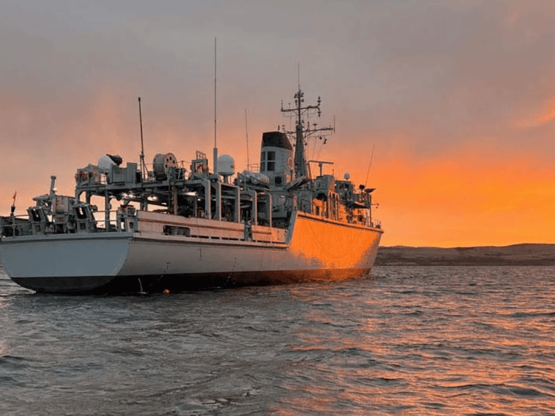 HMS Cattistock at anchor while conducting diving operations. The Royal Navy minehunter is due to replace HMS Middleton in Bahrain, Middle East.