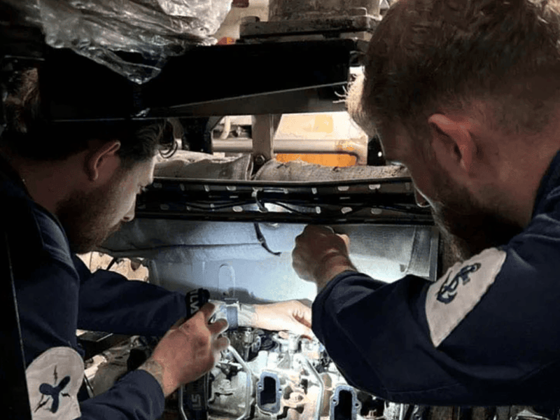 LETME Rhys Owen right and ETME Oliver Schwarz working on HMS Cattistock's G1 Diesel Generator