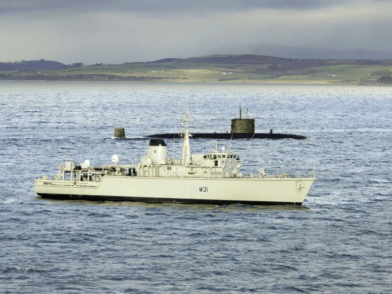 HMS Cattistock training off Scotland with nuclear submarine HMS Triumph.