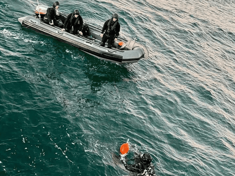 HMS Cattistock's divers complete identification of an object on the sea bed.