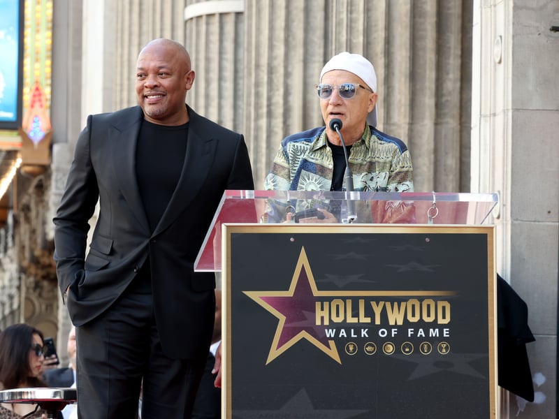 (L-R) Honoree Dr. Dre and Jimmy Iovine speak onstage during the Hollywood Walk of Fame Star Ceremony for Dr. Dre on March 19, 2024 in Hollywood, California.