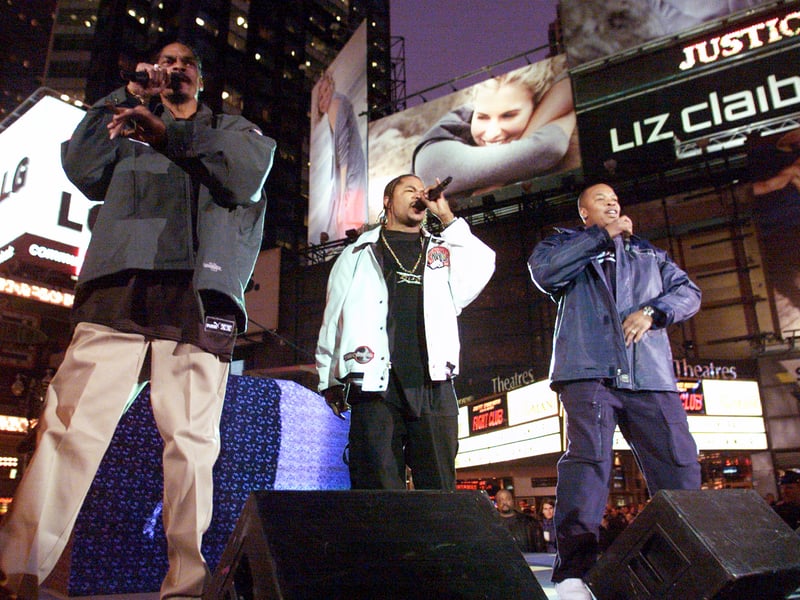 Snoop Dogg (left), Xzibit (center), and Dr. Dre perform on Broadway in Times Square, New York City as part of MTV's Spankin New Music Week.