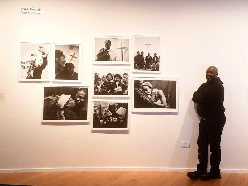 The exhibition also showcases striking new portraits by seven rising stars in UK photography, including Bradford-based photographer Shaun Connell, whose collection 'Near the Cross 'pays tribute both to his Jamaican mother and the Windrush Generation