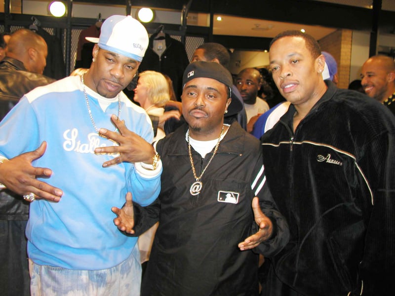 (L-R) Rapper Busta Rhymes, comedian Alex Thomas and rapper Dr. Dre pose at the Nike and Universal Music present Nelly and St. Lunatics American Music Awards Party