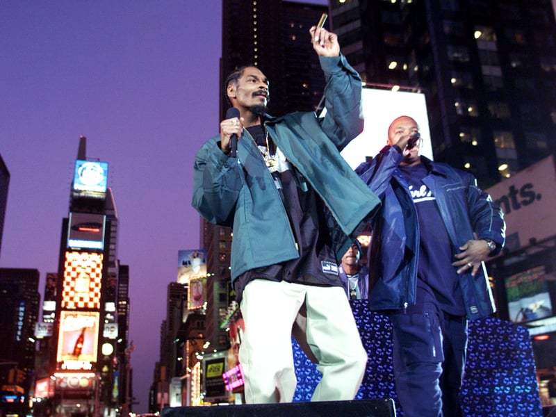 Snoop Dogg (left), and Dr. Dre perform on Broadway in Times Square, New York City as part of MTV's Spankin New Music Week.