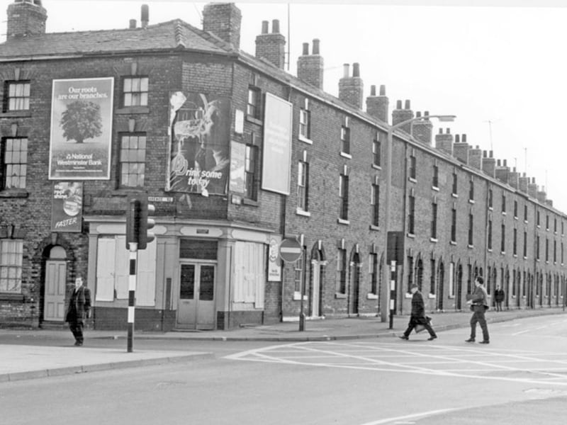 Terraces on Moore Street, Sheffield city centre, at the junction with Clarence Street, pictured some time before they were demolished in the 1960s.