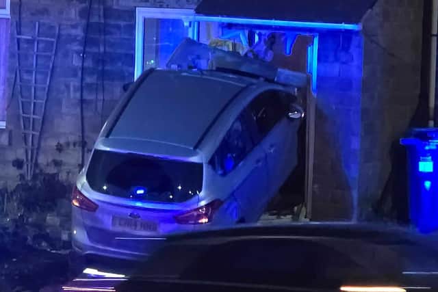 Dramatic pictures after car crashes into house on busy Sheffield road
