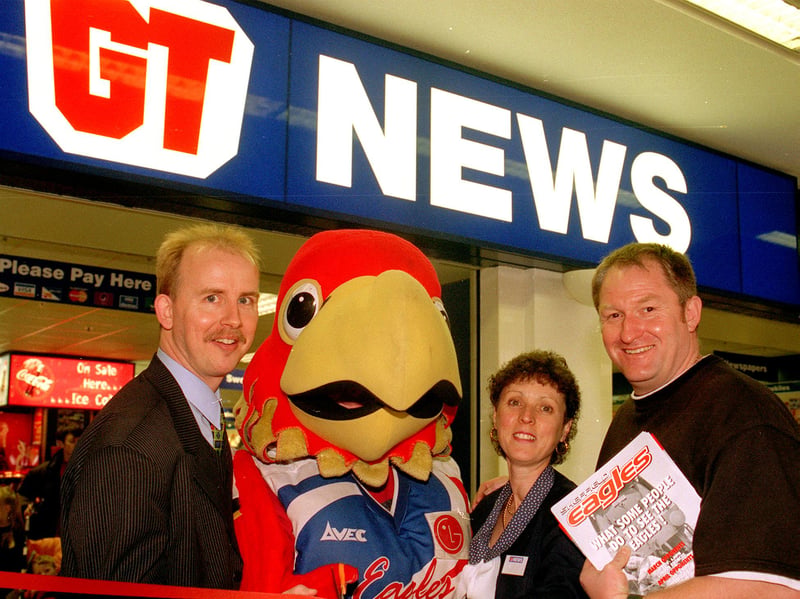 Eagleman cuts the tape at GT News in Crystal Peaks with  store manager Jonathan Langston, Jill Harrison and Eagles manager Mike Turner in 1999