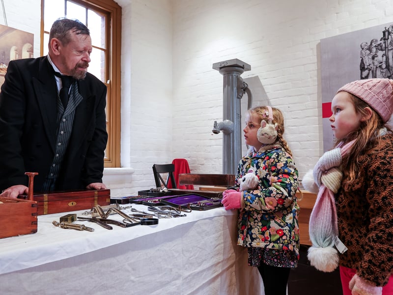 Aria, 6, and Bailey, 5, right, question Dr William Wallington. Mystery at Fort Nelson where junior detectives attempt to solve a crime during half-term. Picture: Chris Moorhouse (180225-59)