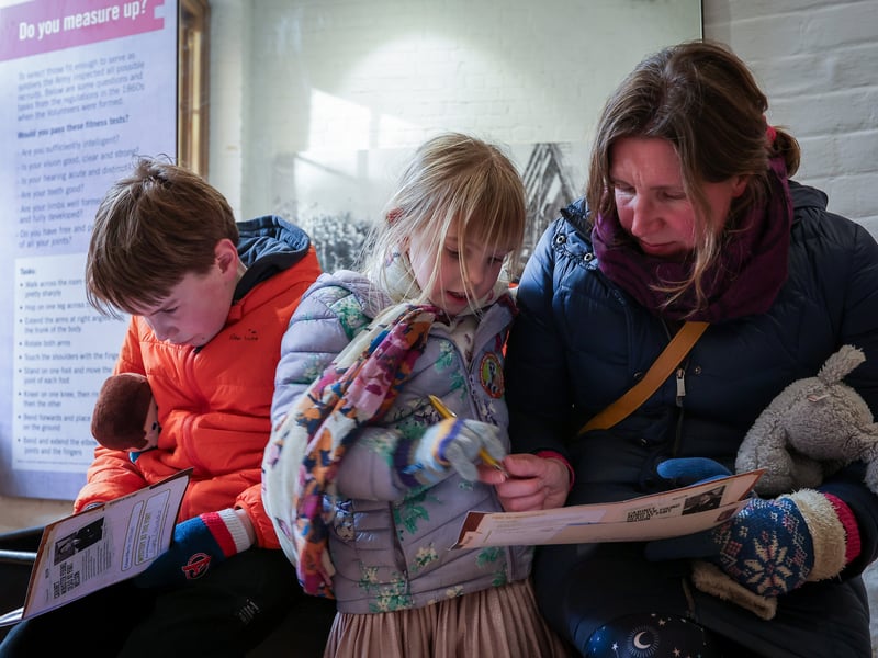 Lizzie George and her children Eleanor, 5, and Dominic, 9, make notes about the clues. Mystery at Fort Nelson where junior detectives attempt to solve a crime during half-term 
Picture: Chris Moorhouse (180225-60)