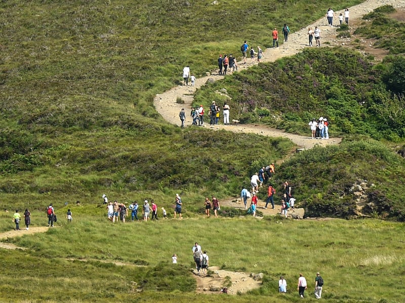 Tourists are seen visiting the Fairy Pools on July 26, 2021 in Glenbrittle.