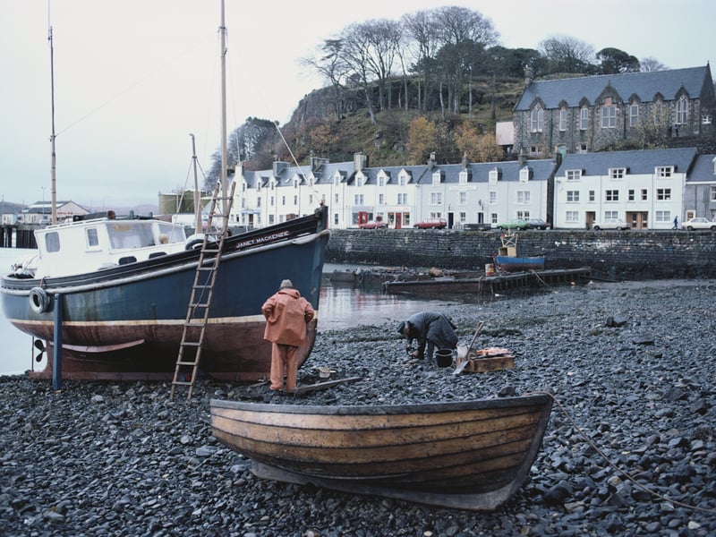 Fishermen by their boat in harbour of the village of Kyleakin, Isle of Skye circa 1982