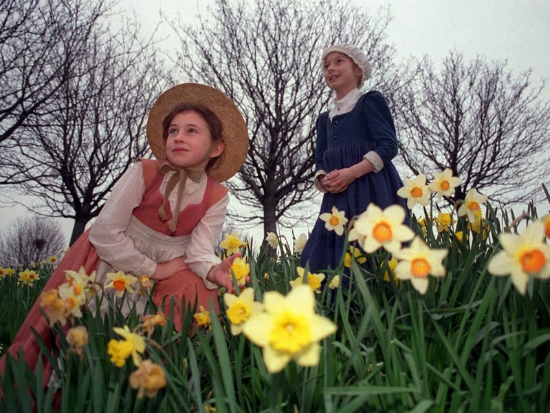 Kippax's Gibson Lane Primary School pupils, Rachel Milburn,, left, and Francesca Kelly rehearse among the daffodils outside West Yorkshire Playhouse. They were both playing William Shakespeare's granddaughter in a production of The Herbal Bed. The pair are pictured in March 1998.