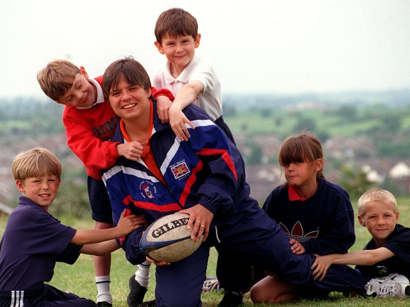 May 1998 and Wakefield Panthers RL player Kirsty Robinson is tackled by some of the Kippax Gibson Lane Junior School pupils who helped raise £50. Pictured, from left, are Liam Costello, Daniel Hall, Mark Curtiss, Alex Beardmore and Sam Field.