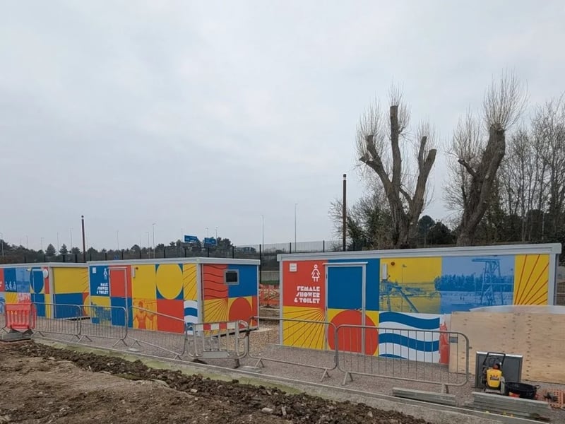 This image shows the modular shower units – you can see the ground is level to the floor.