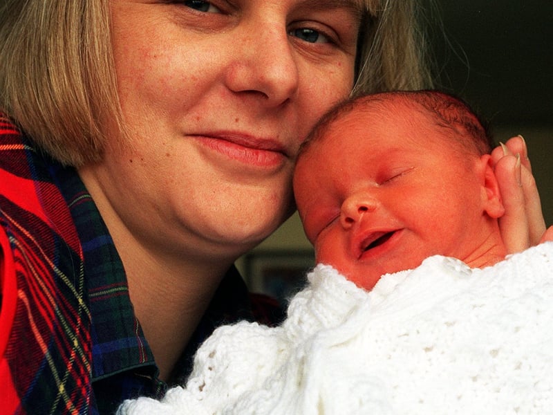 Kippax's Jill Westerman pictured with her unnamed baby girl, who arrived two months early and was the first to be born at St James Hospital on Christmas Day in December 1996.