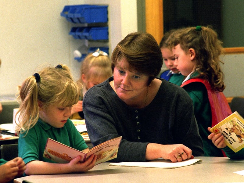 October 1996 and parent Rusty Tiffany keeps a watchful eye over her daughter Heather and son Paul at Kippax Greenfield's Primary School. 
