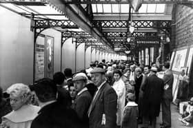 Holidaymakers wait for their train at Sheffield Victoria Station in 1962