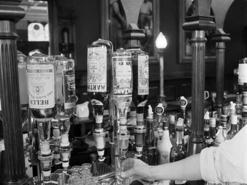 Bottles of whisky, Martini and Cinzano behind the bar in the Cafe Royal, West Register Street Edinburgh, June 1983.