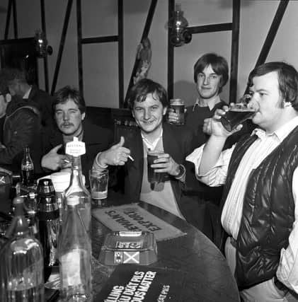 Men from the night shift at the Ferranti factory enjoy an early morning pint of beer at The Cavern pub in Leith, November 1981, following the introduction of early morning opening.