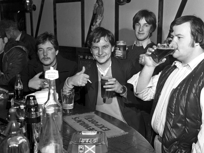 Men from the night shift at the Ferranti factory enjoy an early morning pint of beer at The Cavern pub in Leith, November 1981, following the introduction of early morning opening.