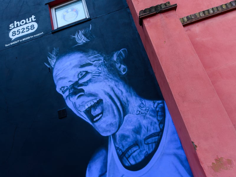 A general view during the unveiling of The Prodigy's Keith Flint mural by street artist Akse P19 ahead of World Suicide Prevention Day 2021 on September 07, 2021 in Hackney, England. The artwork of The Prodigy's former frontman has been created to raise awareness of mental health text support service Shout85258