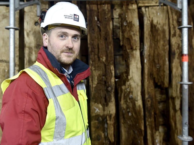 Pictured is: Simon Williams, project manager of HMS Victory The Big Repair, 37, of Southsea, next to one of the timber frames damaged on HMS Victory.
