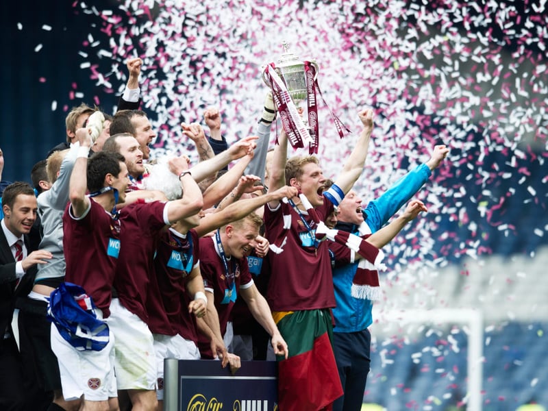 Hearts' captain Marius Zaliukas lifts the William Hill Scottish Cup trophy