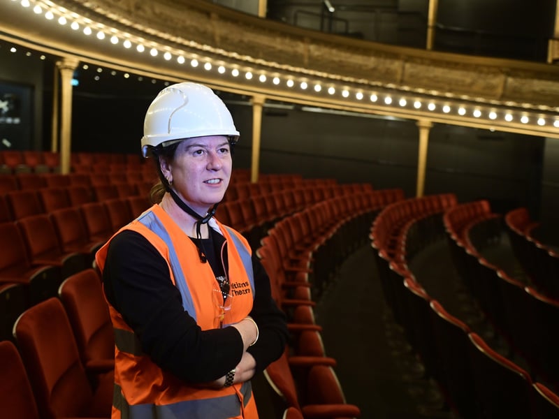 Head of productions, Laura Smith, admires the newly-renovated theatre. The gold and red colour scheme of the Victorian theatre has been retained.