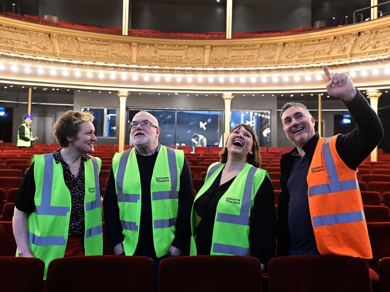 Catrin Evans, participate director at the Citizens Theatre, Dominic Hill, artistic director, Kate Denby, executive director and Graham Sutherland, technical director in the main auditorium of the theatre, which will open in the late summer.