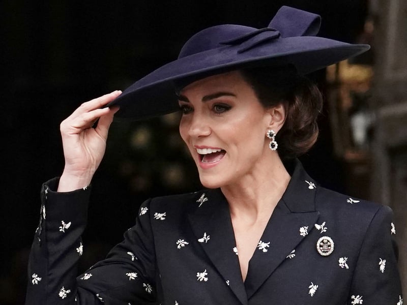 In 2023, Catherine, Princess of Wales, opted for a very chic Erdem navy peplum jacket with a matching skirt