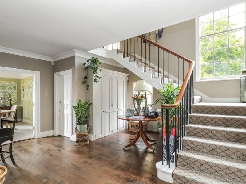 The listing says: "The Dower House is set on the edge of the picturesque village of Hambledon within the South Downs National Park with views over rolling countryside and the neighbouring Hambledon vineyard." 