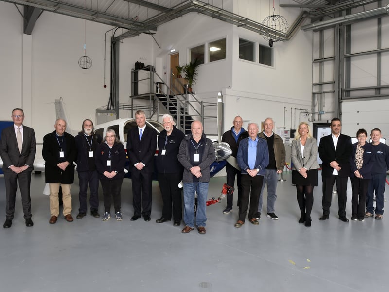 Pictured is: (Five from left) Alderman SeÃ¡n Woodward with former and current councillors, staff at Euro Flight Training and members of the Daedalus Aviation and Heritage Group. Picture: Sarah Standing (100325-460)