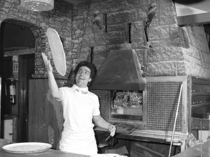 Chef John Alongi tosses a pizza in the Caprice Italian restaurant in Leith Walk Edinburgh, July 1986.