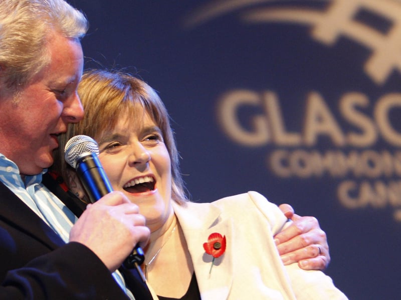 Sports presenter Dougie Donnelly and Deputy First Minister Nicola Sturgeon at the Old Fruitmarket in Glasgow celebrate the announcement that Glasgow will be hosting the 2014 Commonwealth Games