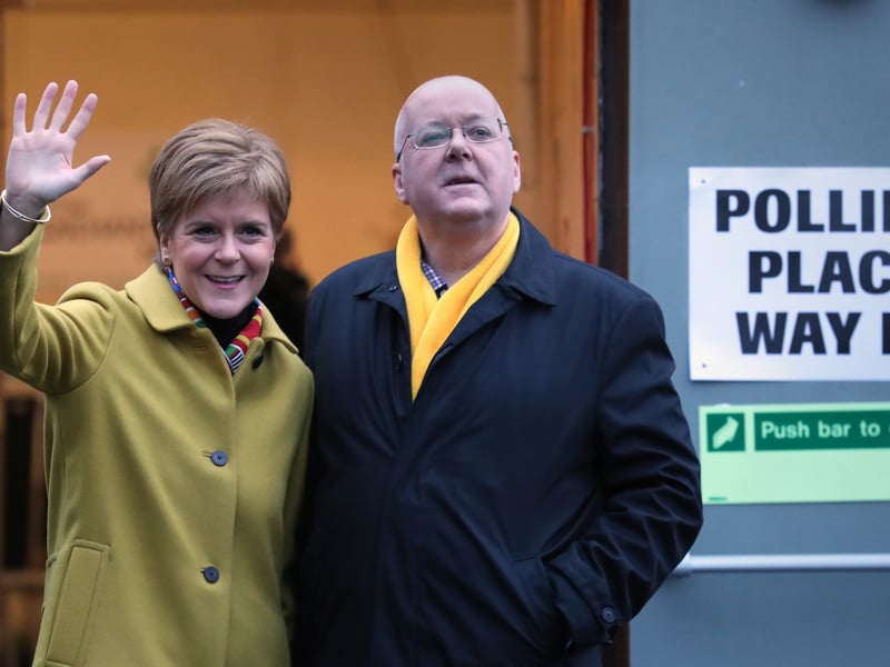 The-then SNP leader Nicola Sturgeon with husband Peter Murrell as they cast their votes in the 2019 General Election at Broomhouse Park Community Hall in Glasgow.