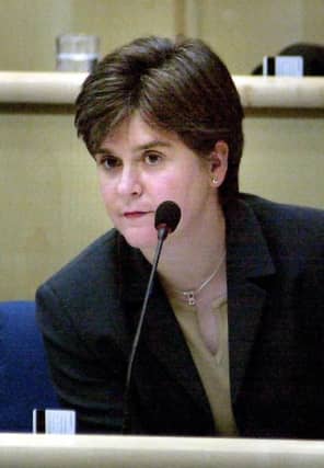 SNP shadow education minister Nicola Sturgeon listening to Sam Galbraith's statement on the exam results fiasco, on the first day of the Scottish Parliament in Edinburgh in 2004