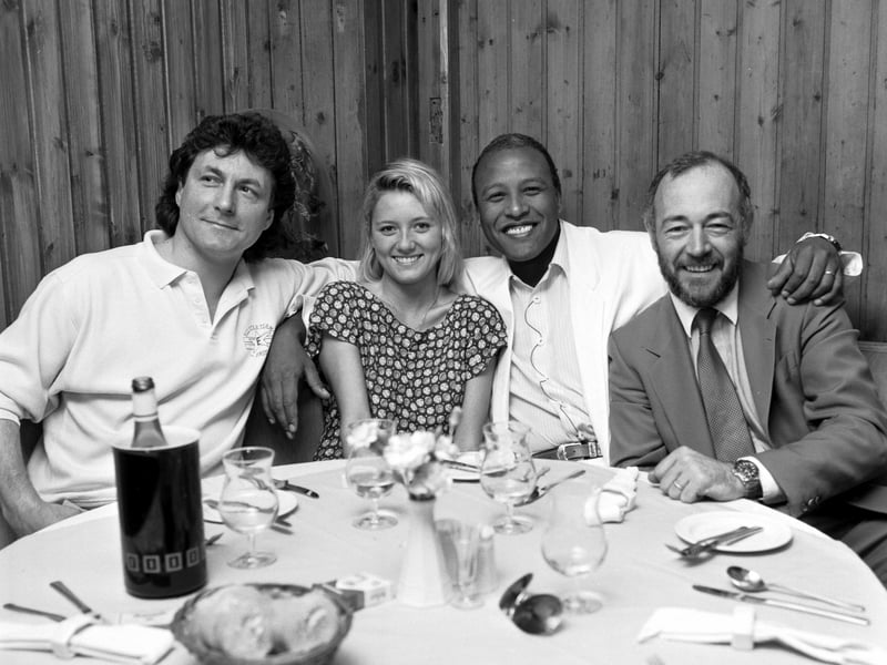 Duran Duran drummer Steve Ferrone (second right) with his wife Jacqueline and Mike Moore (left) in Harry's Bar in Edinburgh, May 1987.  Proprietor Harry Bennett is on the extreme right.