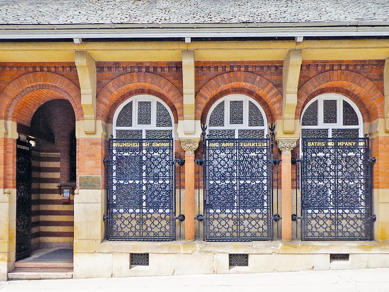 The oldest private baths in Edinburgh,  this 1880s gems was rebuilt in 1900  afer the original building was destroyed by fire.
The "stairs lead down to a perfect pool, skylit under a timber-framed roof supported by brick arches on cast-iron columns," Robin Ward wrote.
The baths are across a Water of Leith footbridge from Dean
Village.