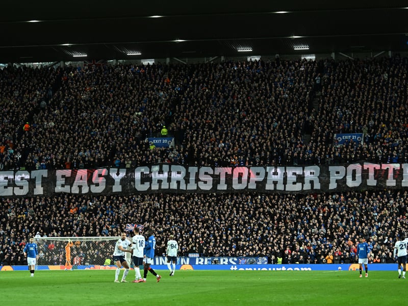 Rangers fans hold up a banner in memory of Rangers fan Christopher Potter.
