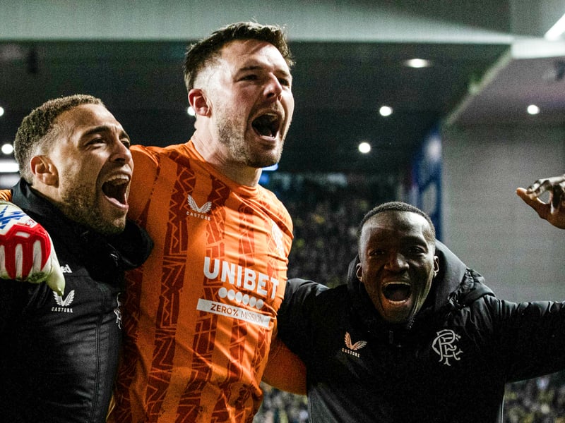 Rangers' Jack Butland celebrates with Cyriel Dessers  (L) and Mohamed Diomande (R).